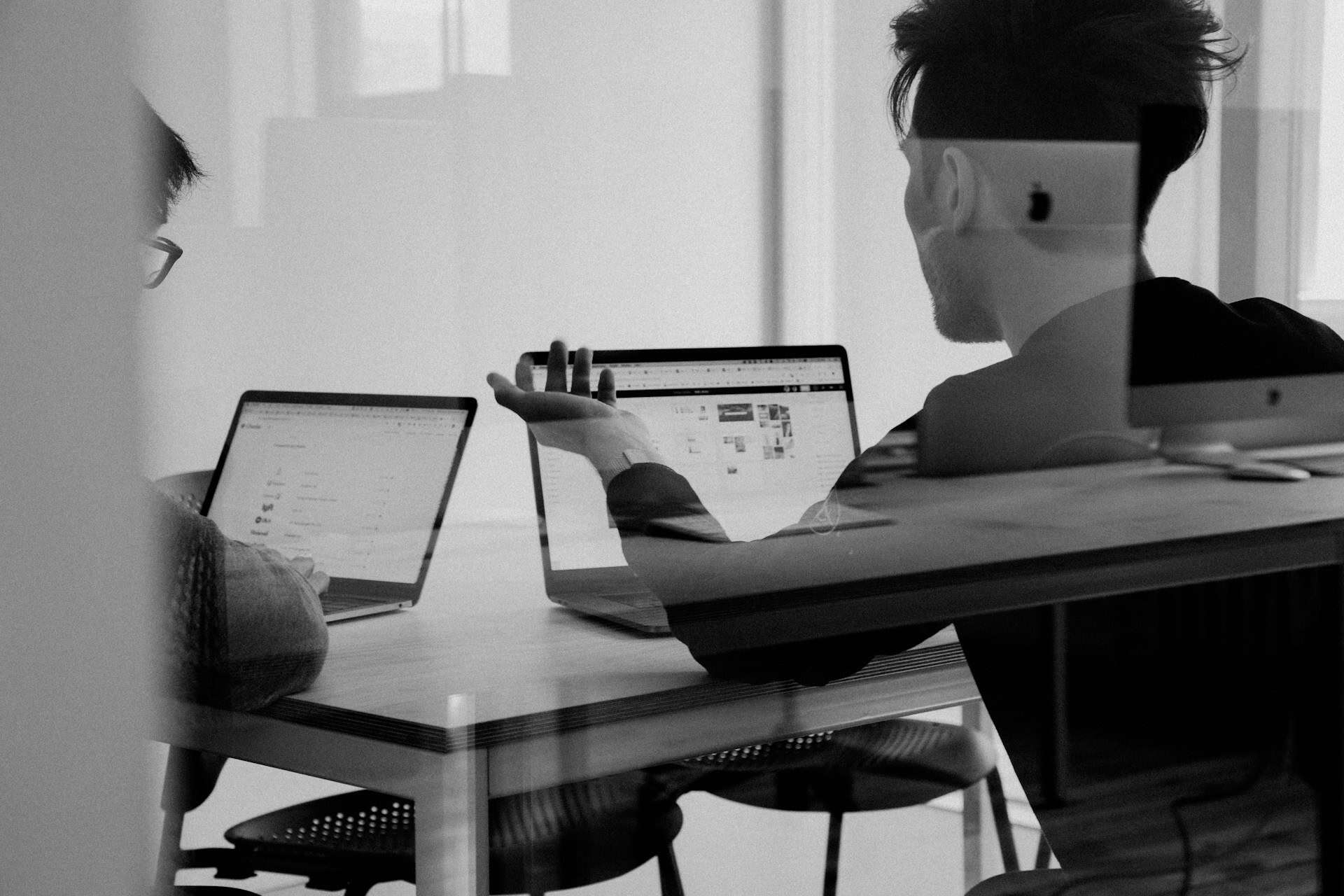 consultants using laptops to manage ai follow up sequences and client communication